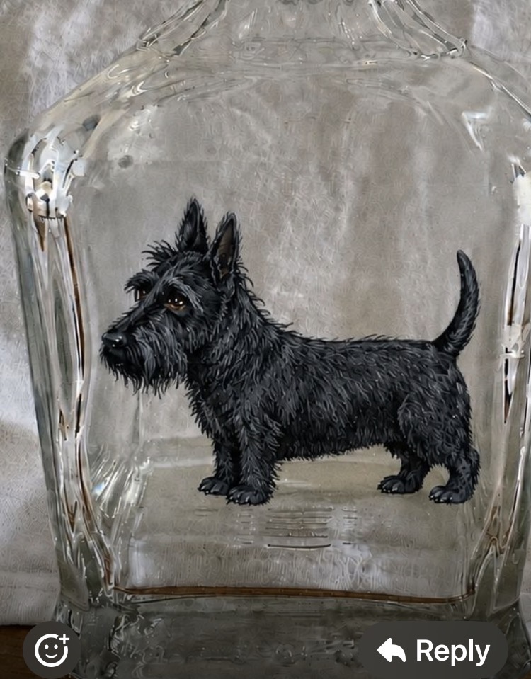 Little Bonnie painted on the side of an old glass whiskey bottle